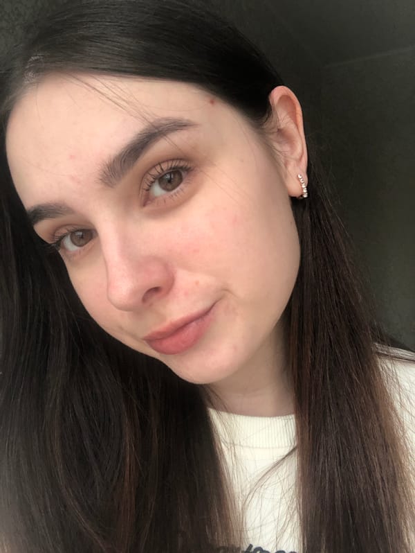 Woman photographed wearing white sweater, decorative ear cuff in Russia