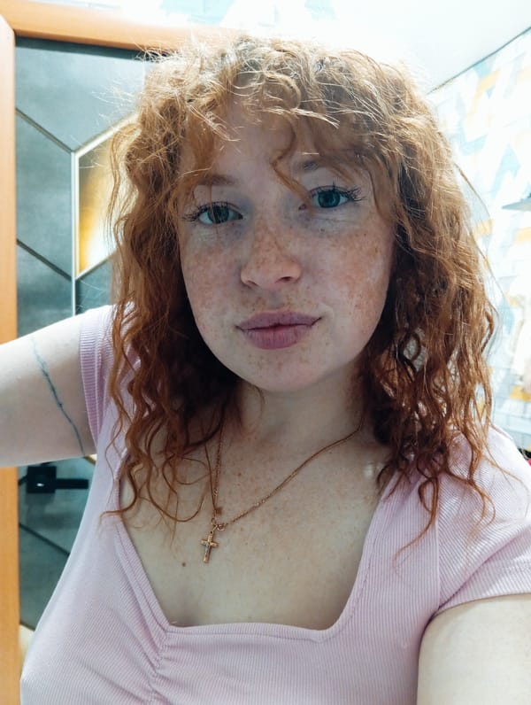 Red-haired person captured in casual moments in Yurgamysh, Russia