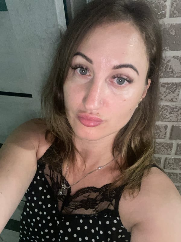 Selfie portrait in Zarichne, Ukraine, polka dot top and silver necklace