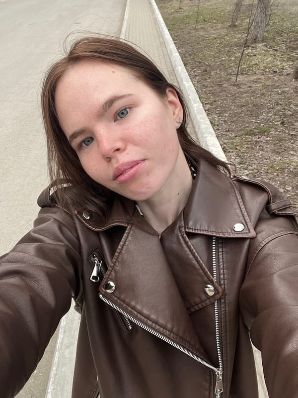 Woman documents spring blossoms during early morning walk in Chaikovsky