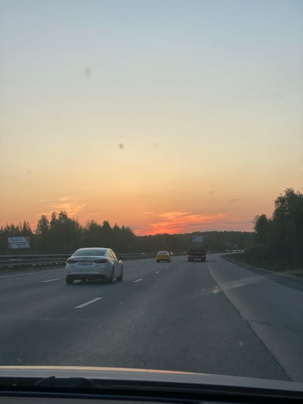 Evening highway traffic observed near Yekaterinburg during sunset