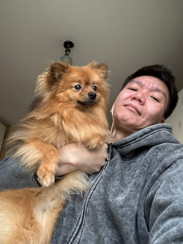 Man photographed with Pomeranian dog at home in Khimki