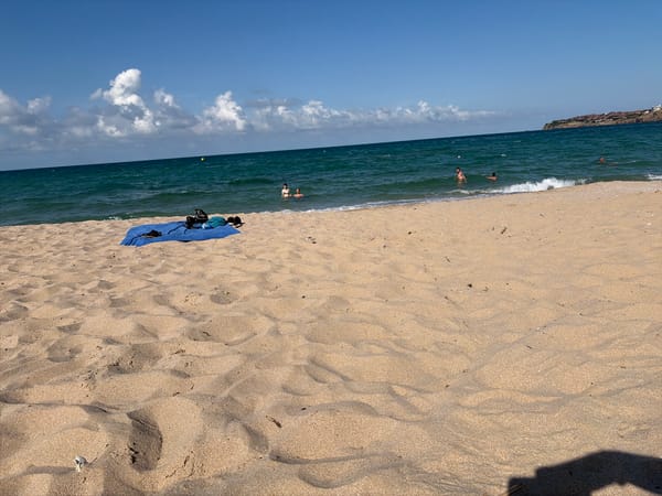 Sunny beach day in Sozopol with a glimpse of the town