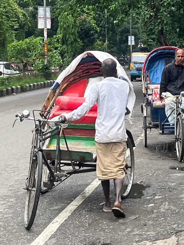 Rickshaw operator spotted on Dhaka street scene