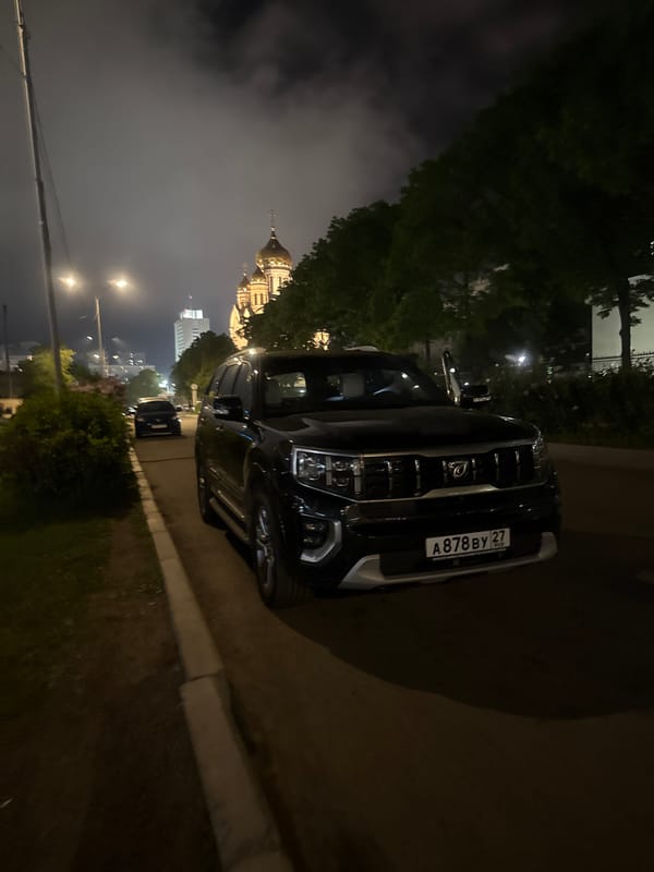 Nighttime scenes captured across Vladivostok harbor and streets