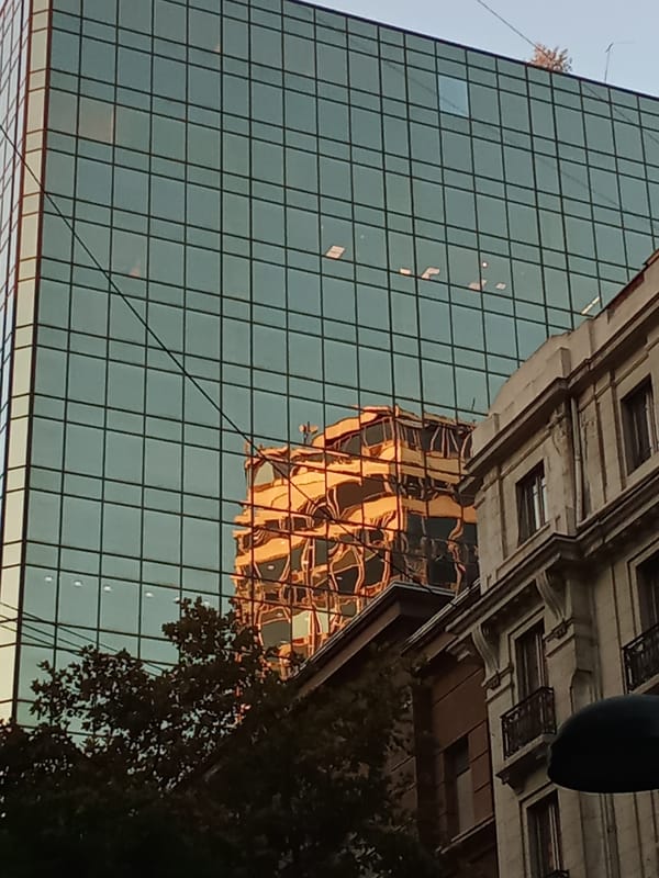 Santiago residents document city's architectural mix during golden hour