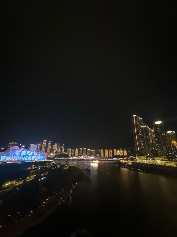 Chongqing's Jiangbeicheng skyline glowing across the Yangtze at night