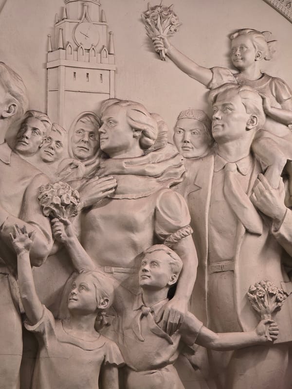 Bas-relief sculpture with adult, children figures observed in Moscow