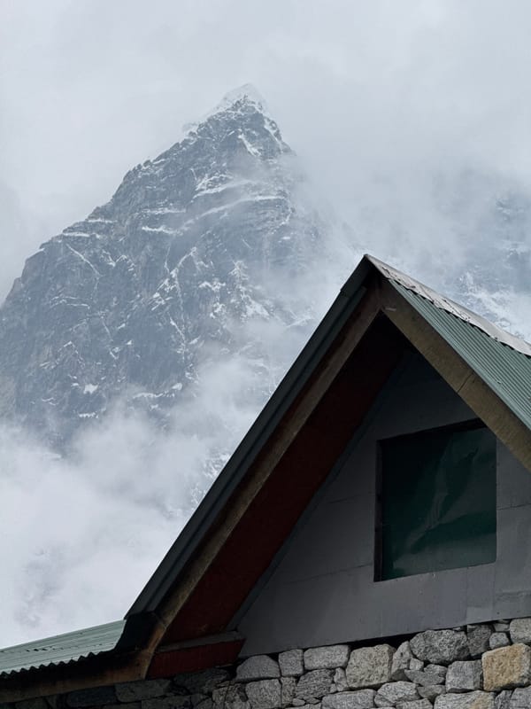 Building observed against mountain backdrop in Dughla, Nepal