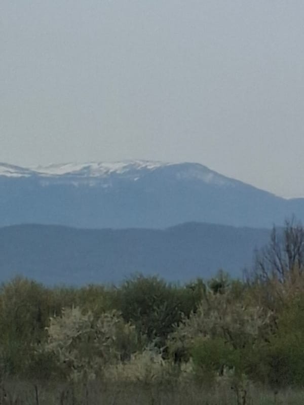Snow-capped peaks observed under overcast skies in Blagovo, Bulgaria