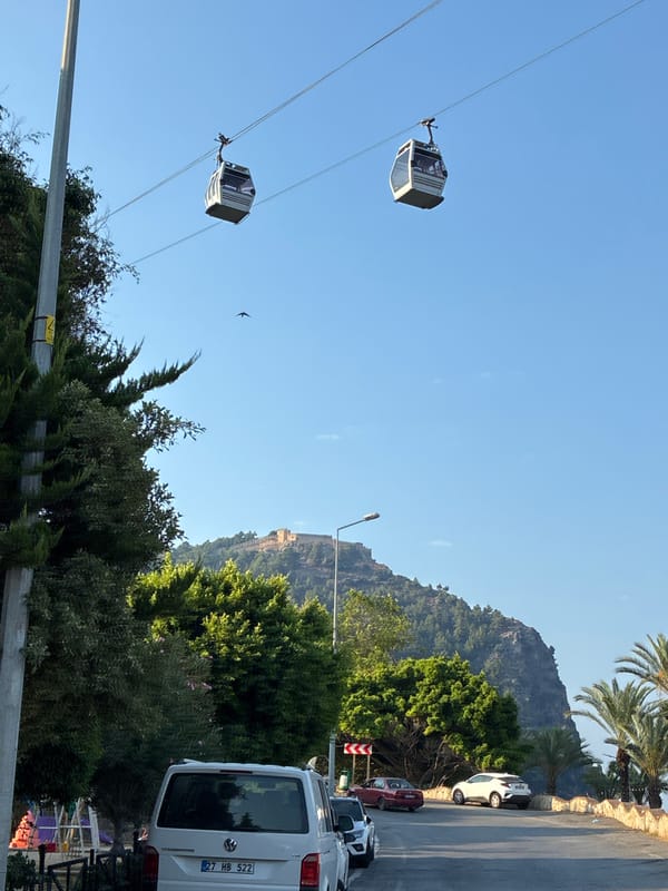 Morning views from Alanya's hilltop: cable cars, coastline, and old city