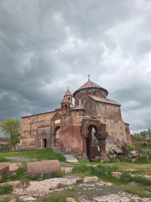 Visitors document historic Armenian monastery and countryside scenery