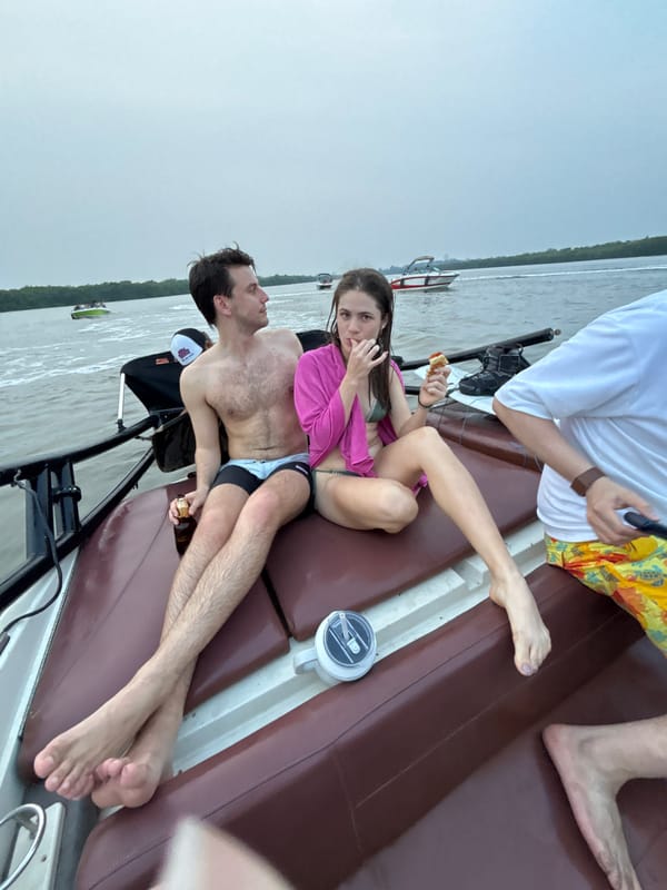 Multiple boats gather for nighttime water party