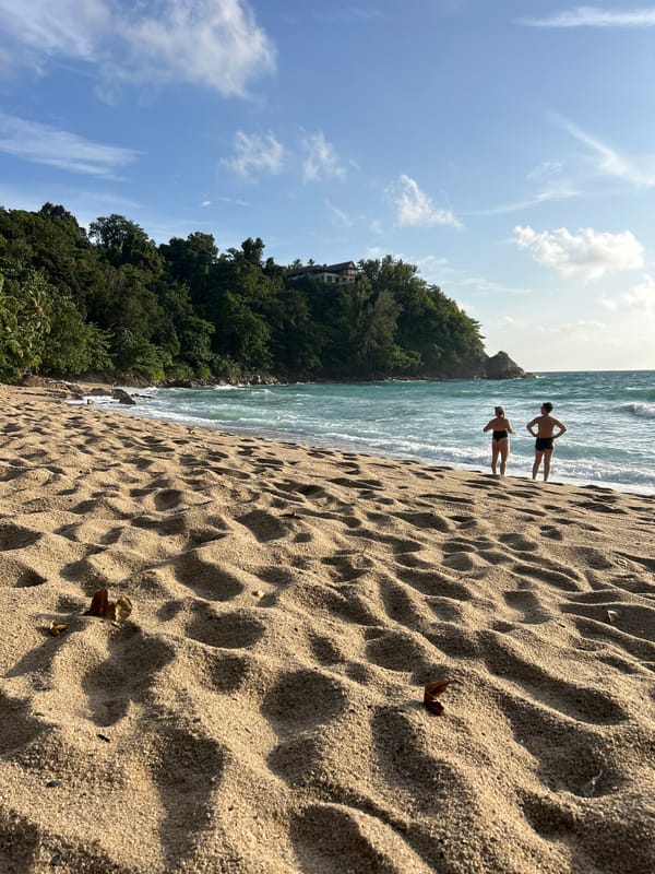 Rocky Choeng Thale shoreline at golden hour, waves and all