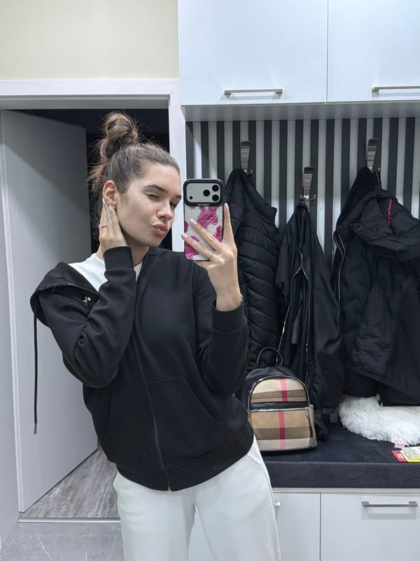 Woman takes selfies in hallway in Dobrich, Bulgaria