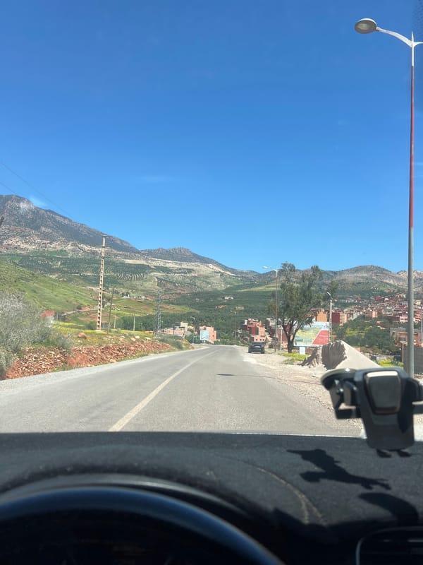 Vehicle journey through Ouaouizert Morocco captures street scenes