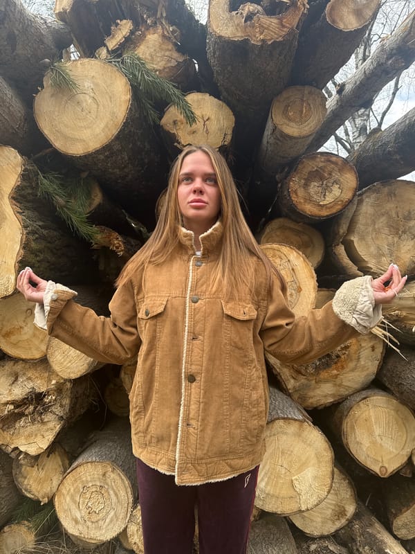 Woman poses on logs, dogs filmed in marsh in Grebnevo