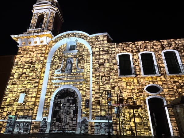 Church in Puebla illuminated with projected faces display