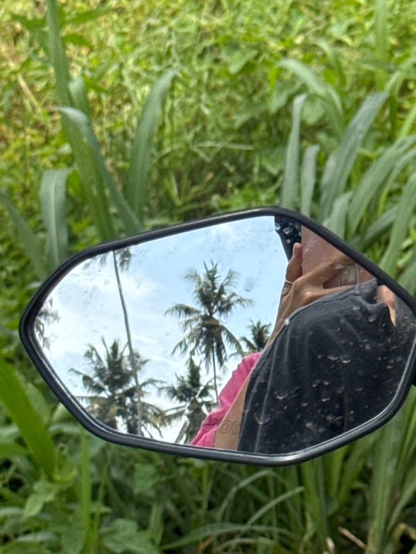 Motorbike rider captured in mirror reflection in Thiththagalla