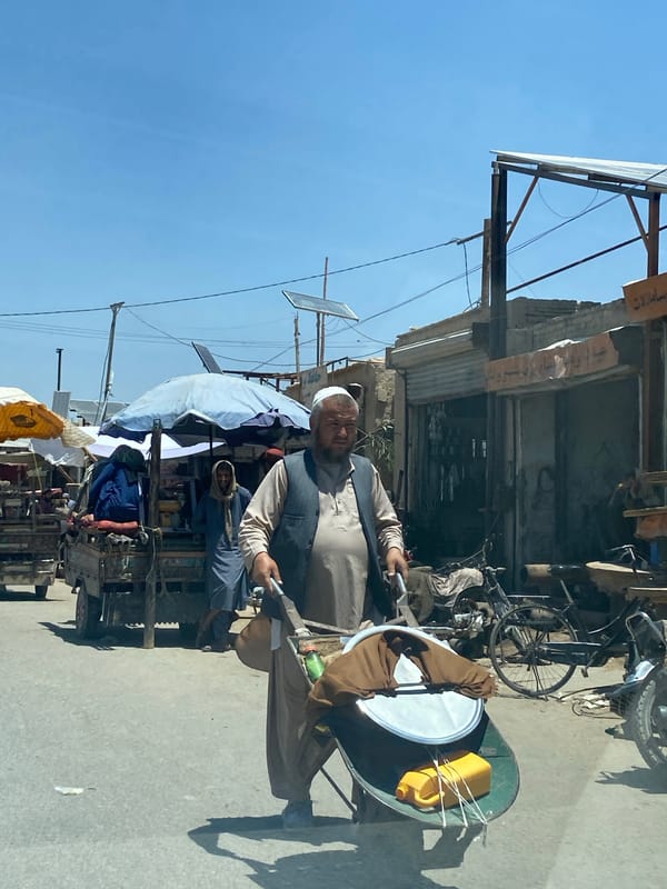 Street activity in Kandahar's commercial district on a clear morning