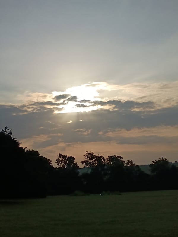 Sunbeams breaking through clouds over Frankfort, Kentucky