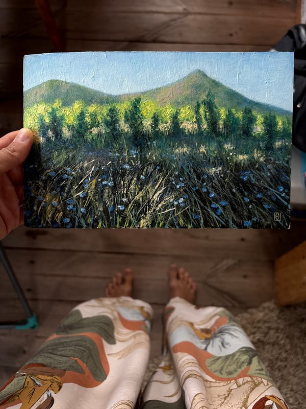 Person displays landscape painting in Ulyanovsk, Russia