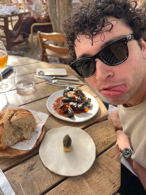 Man takes playful selfie at Spanish restaurant