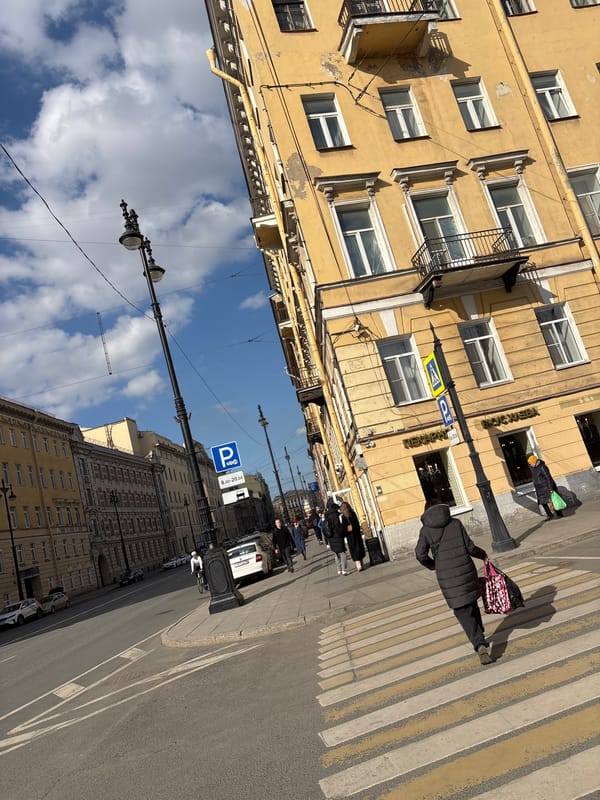 Tourist documents central Saint Petersburg landmarks during morning walkabout