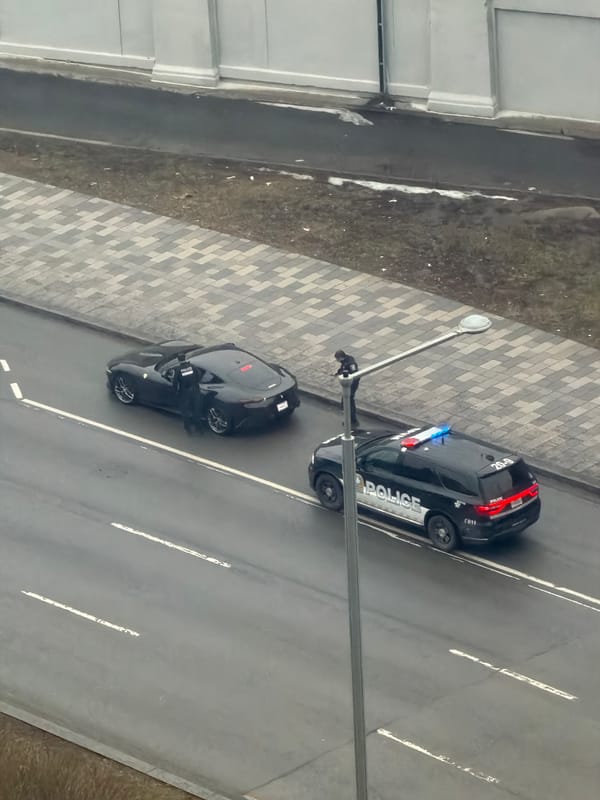 Police conduct traffic stop of sports car in Montreal