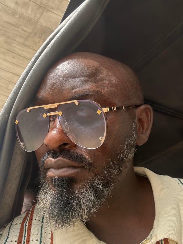 Man sleeps in leather chair in Lekki, Nigeria