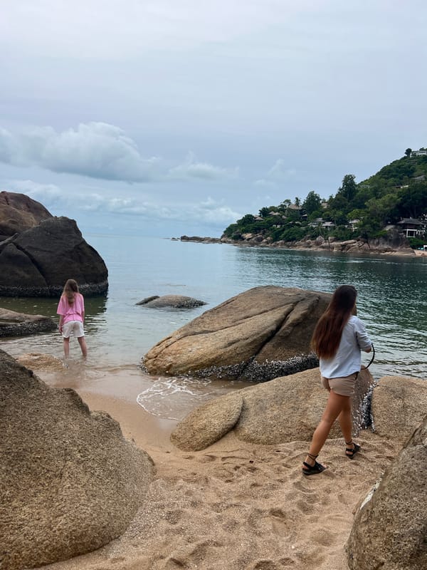 Two women spend quiet moments at Thai beach