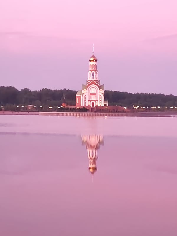Orthodox church and cargo ship observed in Sverdlovo riverfront