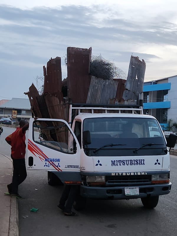 Scrap-laden Mitsubishi truck parked in Kabong, Nigeria