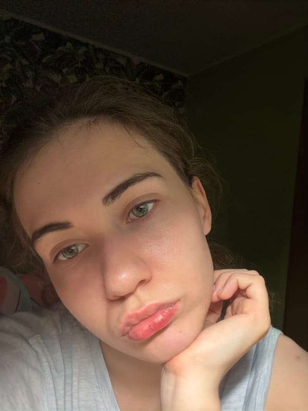 Selfie session at home in Zavodoukovsk, with a movie playing nearby.