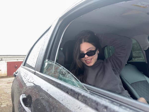 Woman spotted in car during rainy morning in Perm