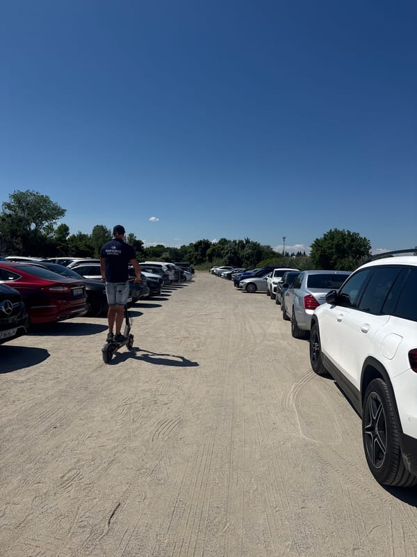 Luxury cars fill a Nesebar beachside venue parking lot