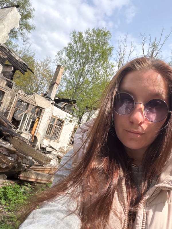 Woman photographs herself outdoors in Tokkari, Russia