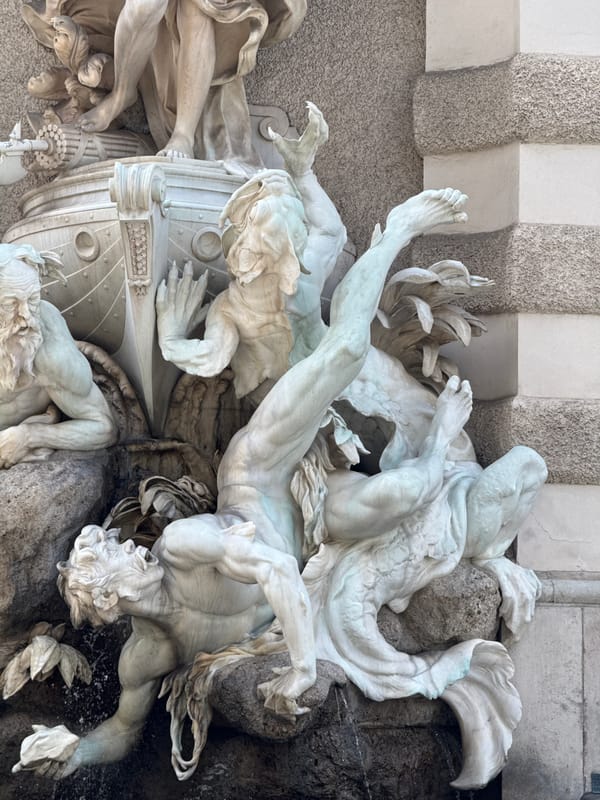 Tourist documents baroque architecture during Vienna walking tour