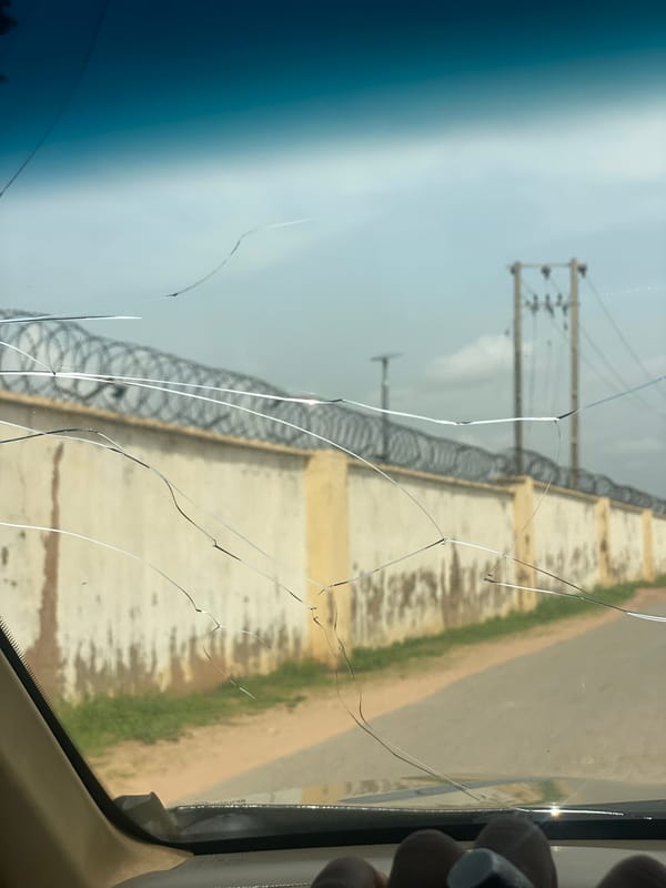 Car journey documented through residential Howayi, Nigeria neighborhoods