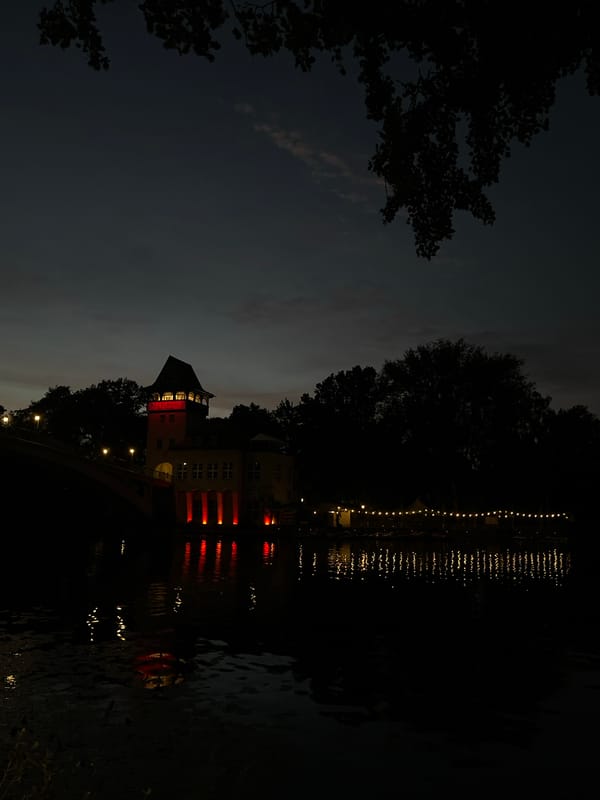 Dusk along the Spree: tall ships, Klipper restaurant, and waterfront art