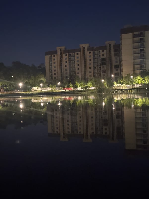 Evening waterscape captured in Shchyolkovo, Russia shows residential reflections