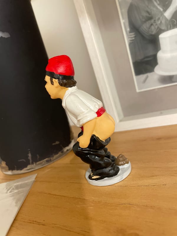 Collection of figurines and decorative objects displayed in Buenos Aires home