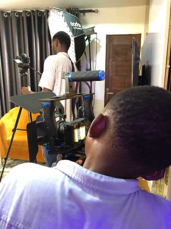 Film crew captures ukulele session under purple studio lights