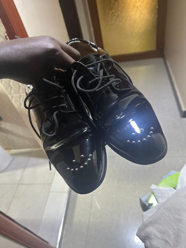 Studded patent leather oxfords on display in Dar es Salaam