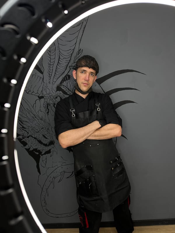 Chef poses against dragon mural in Saratov