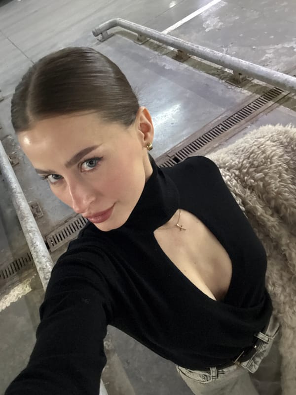 Woman takes selfie in concrete structure in Krasnoyarsk