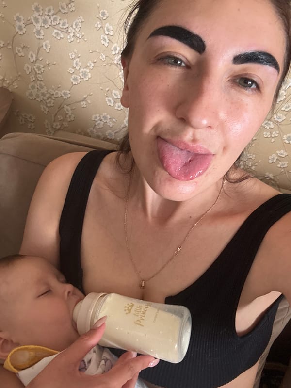 Mother feeds baby, toddler plays in Sochi home