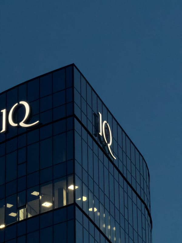 IQ Business Center glows against Brest's twilight sky