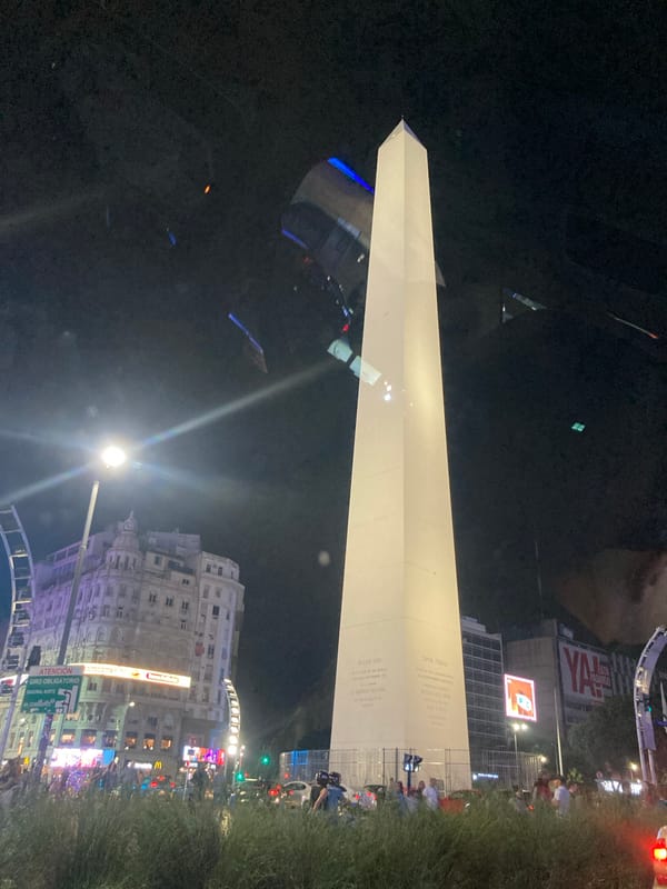 Buenos Aires Obelisk draws nighttime crowd, monument illuminated