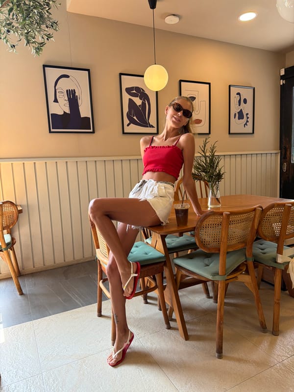 Woman poses at cafe in Choeng Thale, Thailand